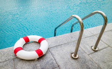 Life ring at swimming pool.emergency tire floating at swimming pool.